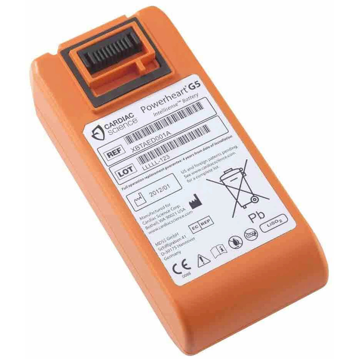 Cardiac Science Powerheart G5 Intellisense orange rectangular AED battery, angled view from the opposite side showing the connector tab and label with REF XBTAED001A and LOT number