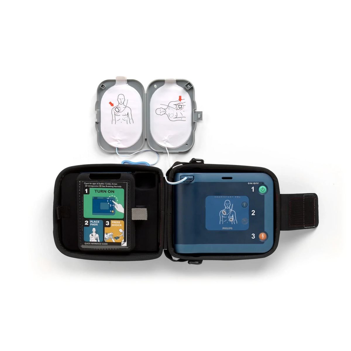 Philips HeartStart FRx AED full setup open in its carry case with quick reference guide and Smart Pads deployed