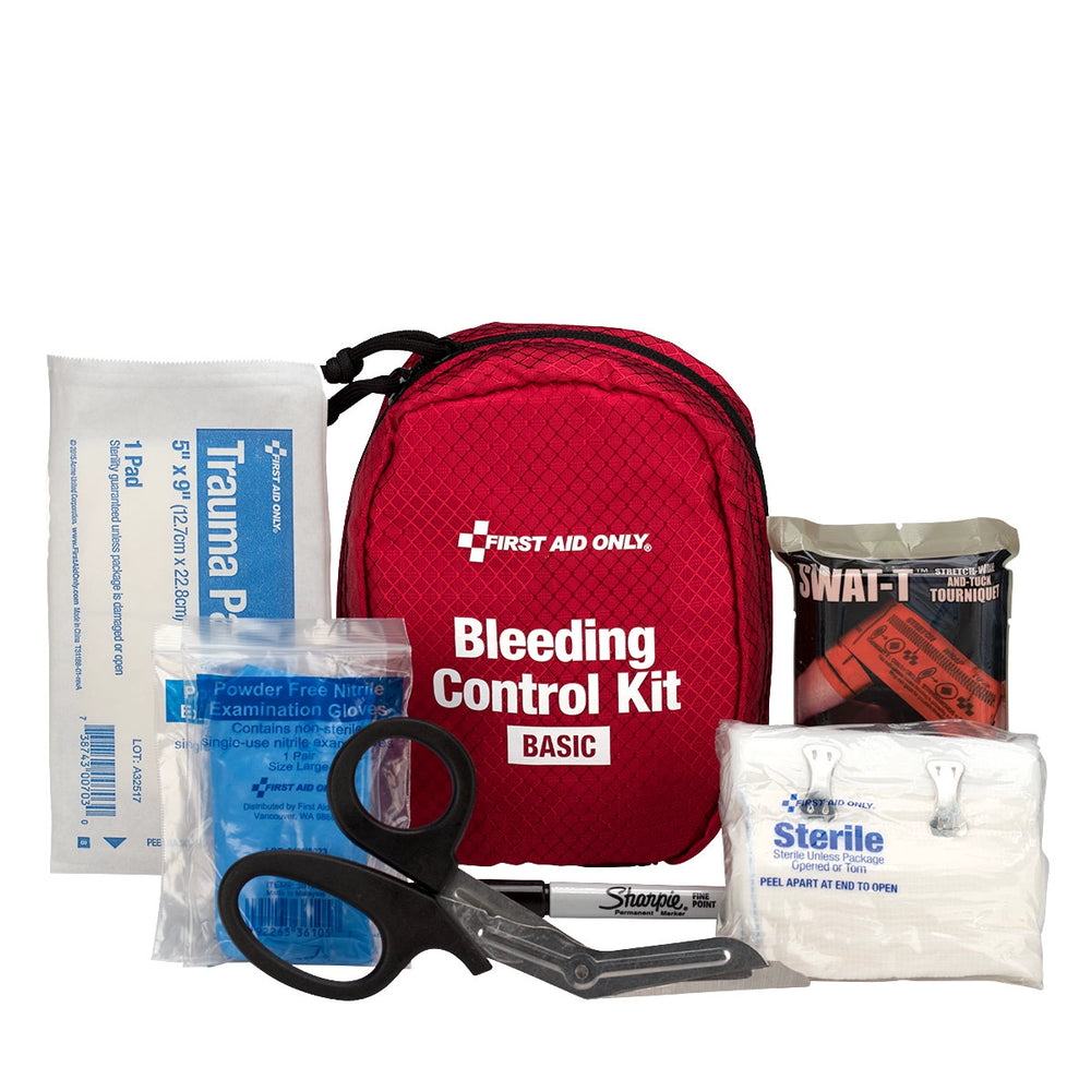 First Aid Only Bleeding Control Kit with tourniquet, gauze, gloves, and trauma shears laid out