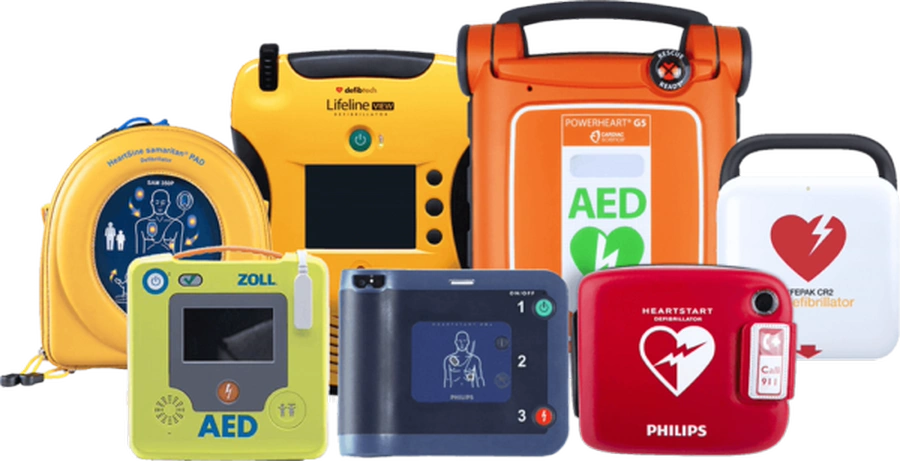Lineup of yellow, orange, blue, and white AED defibrillator models grouped together