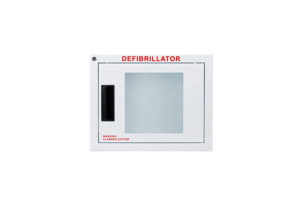 White wall-mounted defibrillator cabinet with a clear window labeled Defibrillator