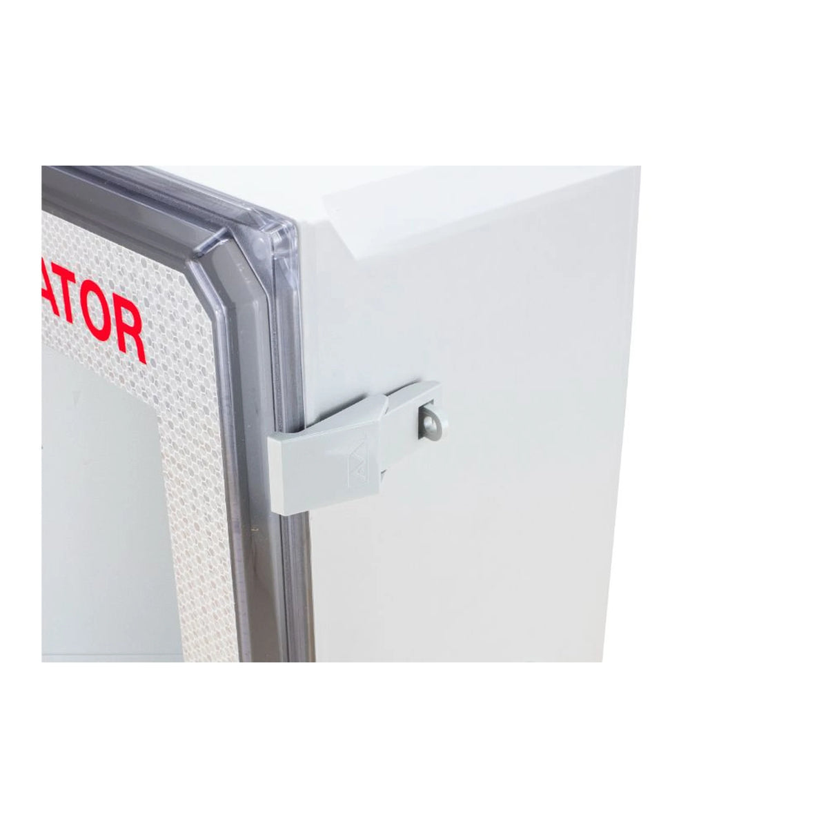 Outdoor AED wall cabinet corner detail, showing the gasketed clear door seal and a stainless steel hinge latch
