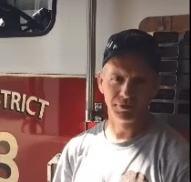 man in front of fire truck