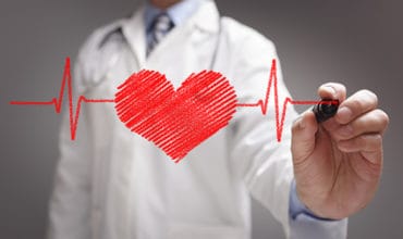 Doctor drawing ecg heartbeat chart