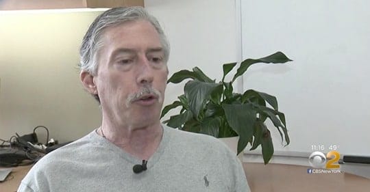 man in front of plant and being interviewed for TV