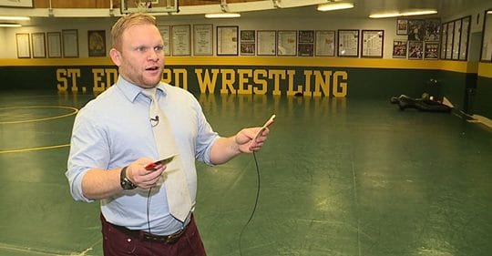 man with aed pads in wrestling room