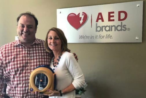 man and woman with AED