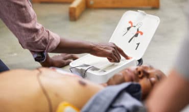 LIFEPAK CR2 In-Use - Man w Pads-Woman Pushes Shock